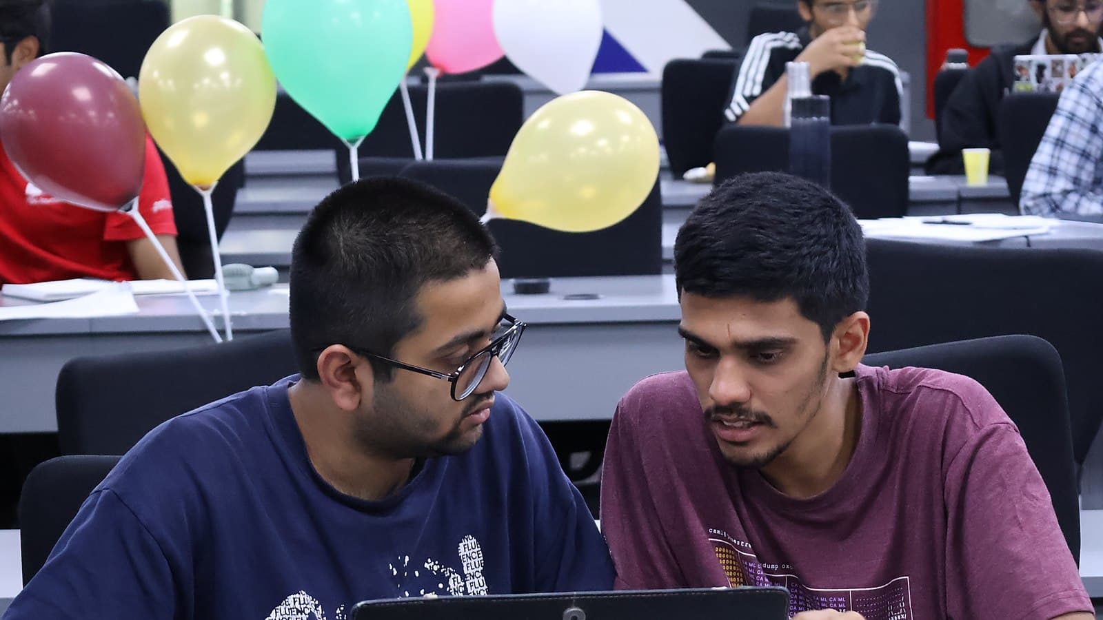 A pair working through a problem at Ascent