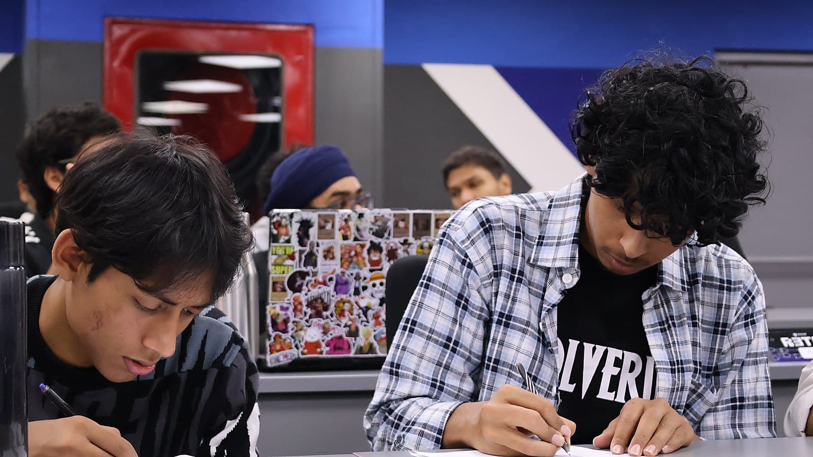 Contestants working through the problem set at Yugaantar